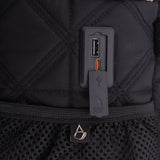 Close-up of Aerolite backpack's USB charging port, highlighting its convenient design for charging devices on the go during travel.