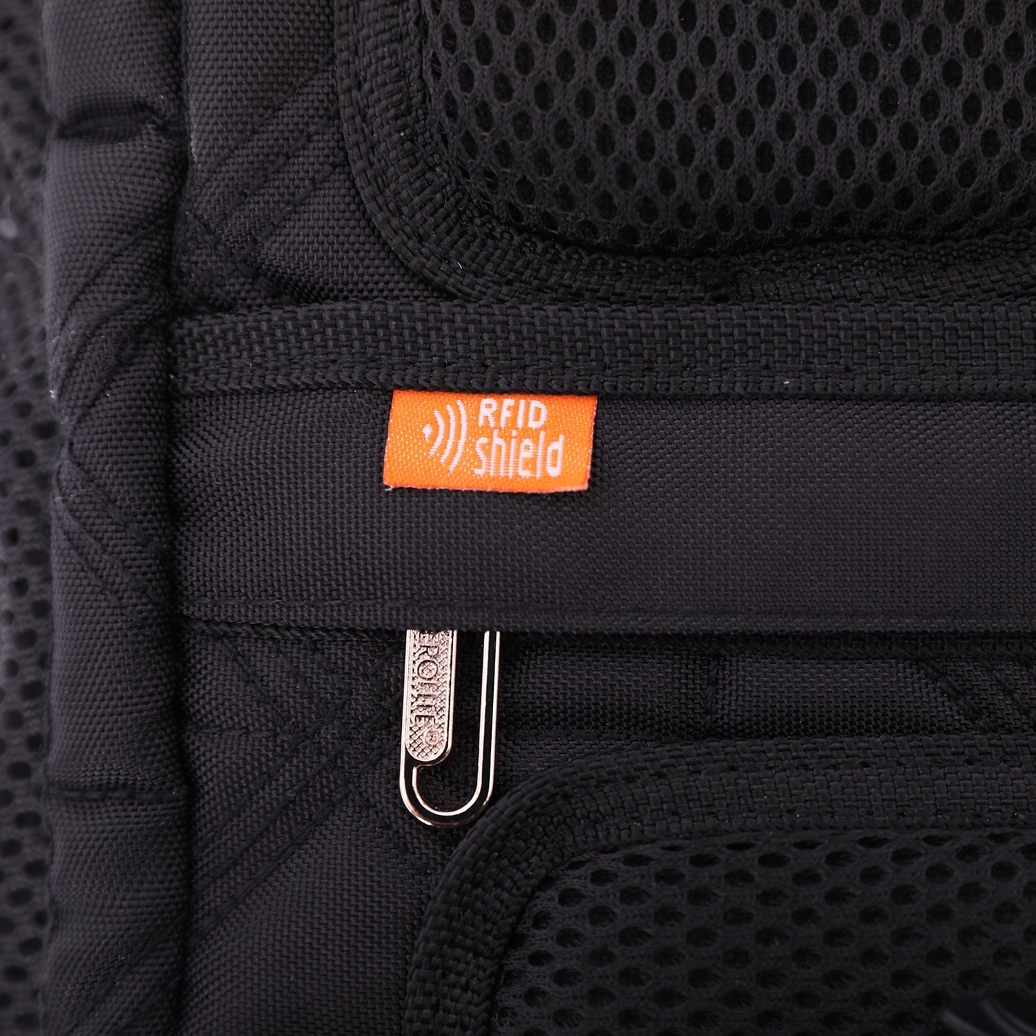Close-up of Aerolite backpack's RFID shield tag, emphasizing its security feature for protecting personal information during travel.
