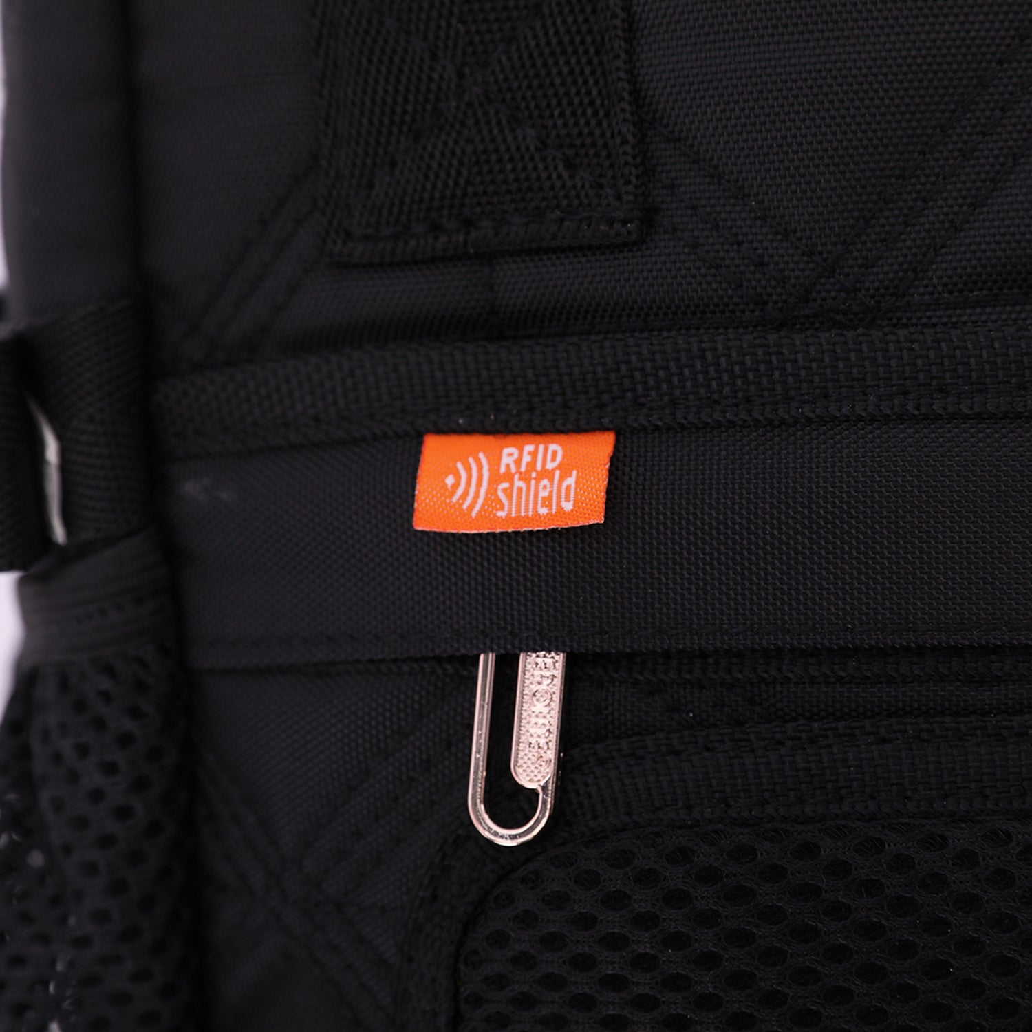 Close-up of the Aerolite 40x20x25cm Ryanair Maximum Eco-Friendly Backpack Trolley Bag showcasing the RFID shield tag and durable black quilted fabric.