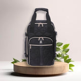 Aerolite eco-friendly backpack displayed on a wooden platform with green leaves, emphasizing its sustainable design and stylish quilted finish.