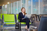 Woman with Aerolite MiniMAX trolley backpack at airport